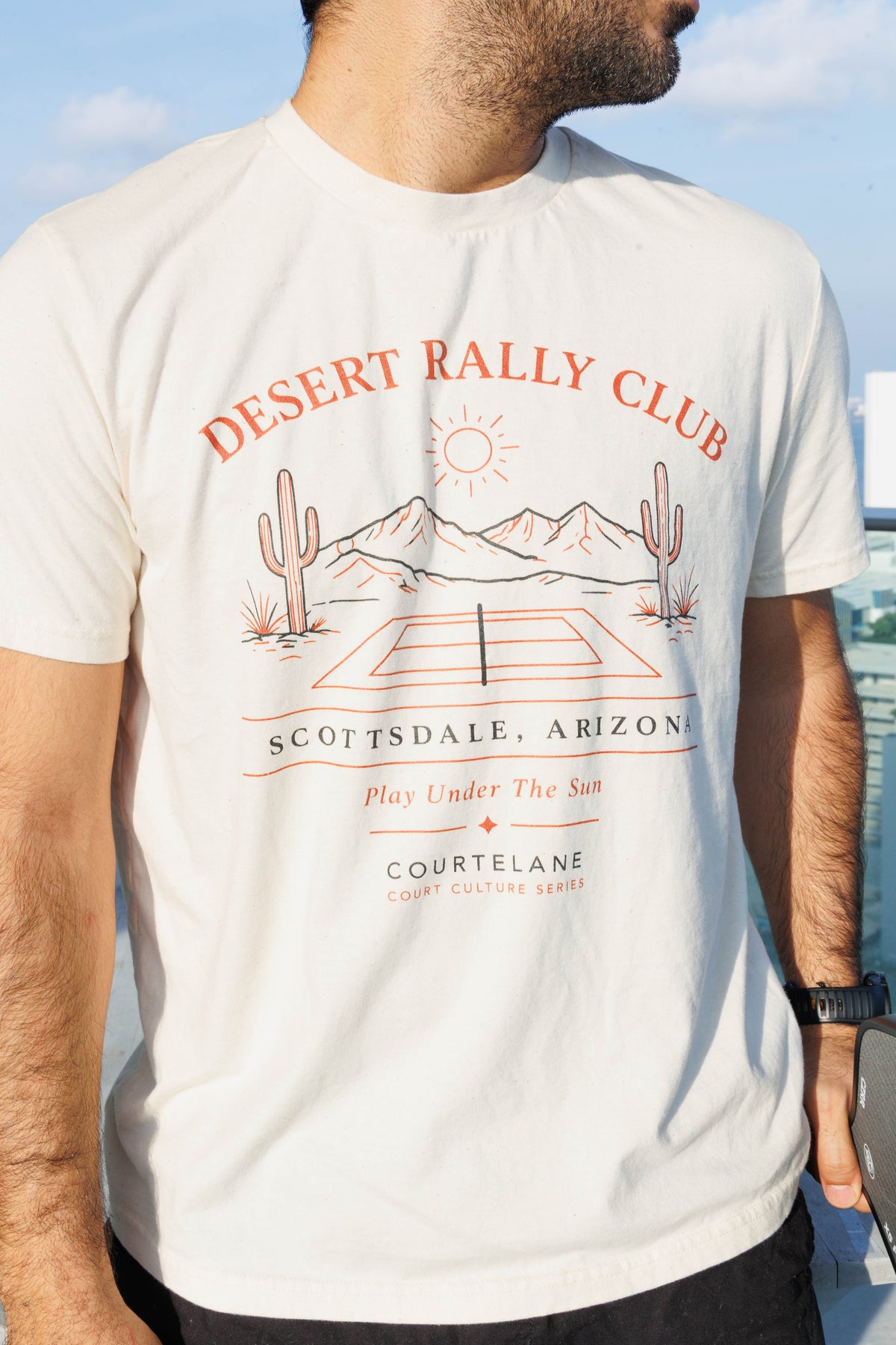 Side angle close up of the Courtelane Scottsdale Desert Rally Club tee, men's fit