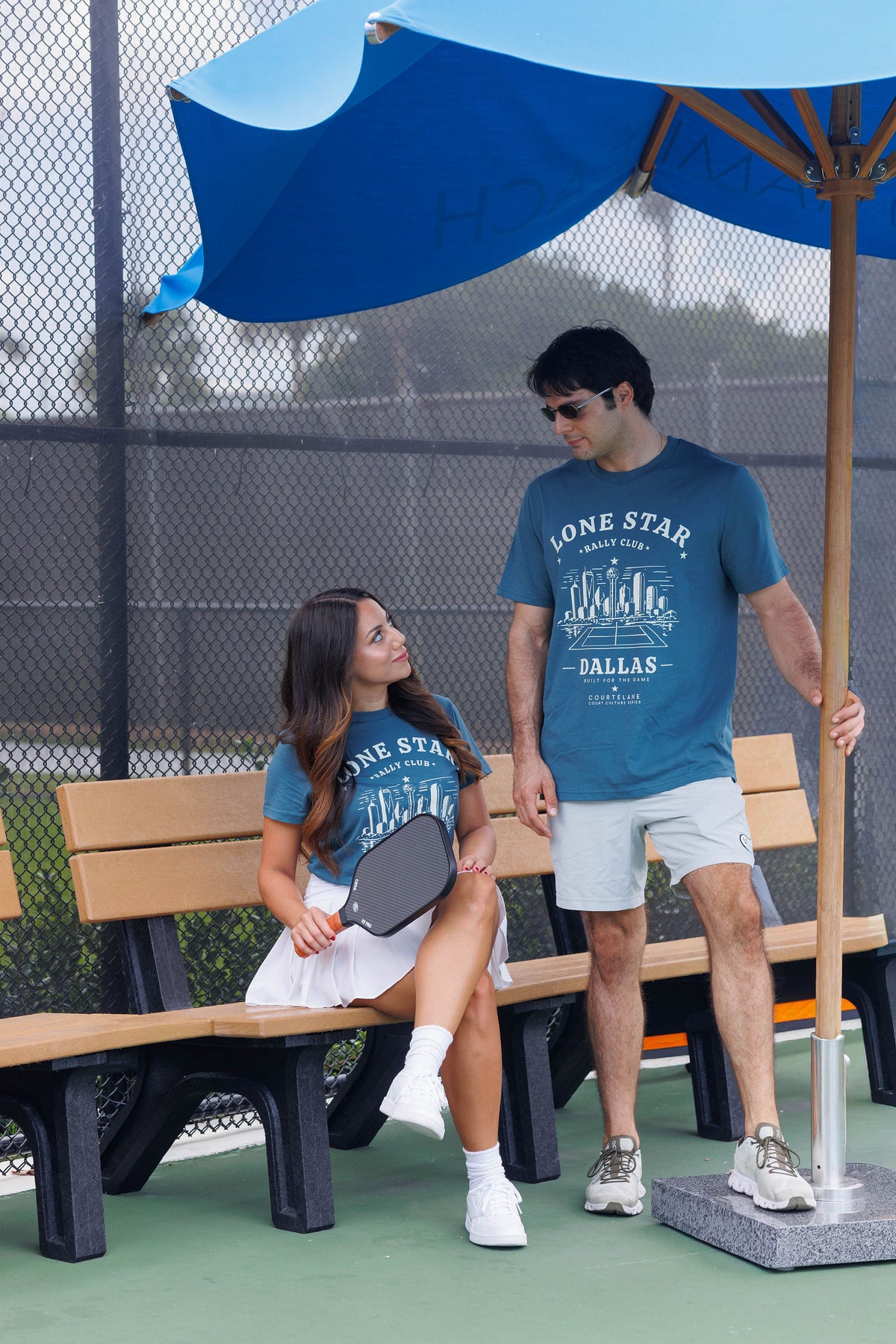 Courtelane players on court wearing City Series tees