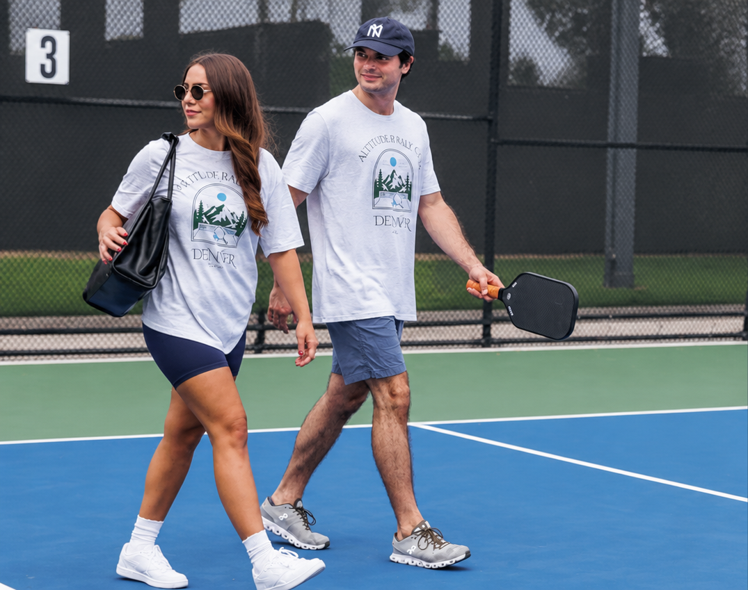 Two pickleball players walking off the court in Courtelane Denver tees