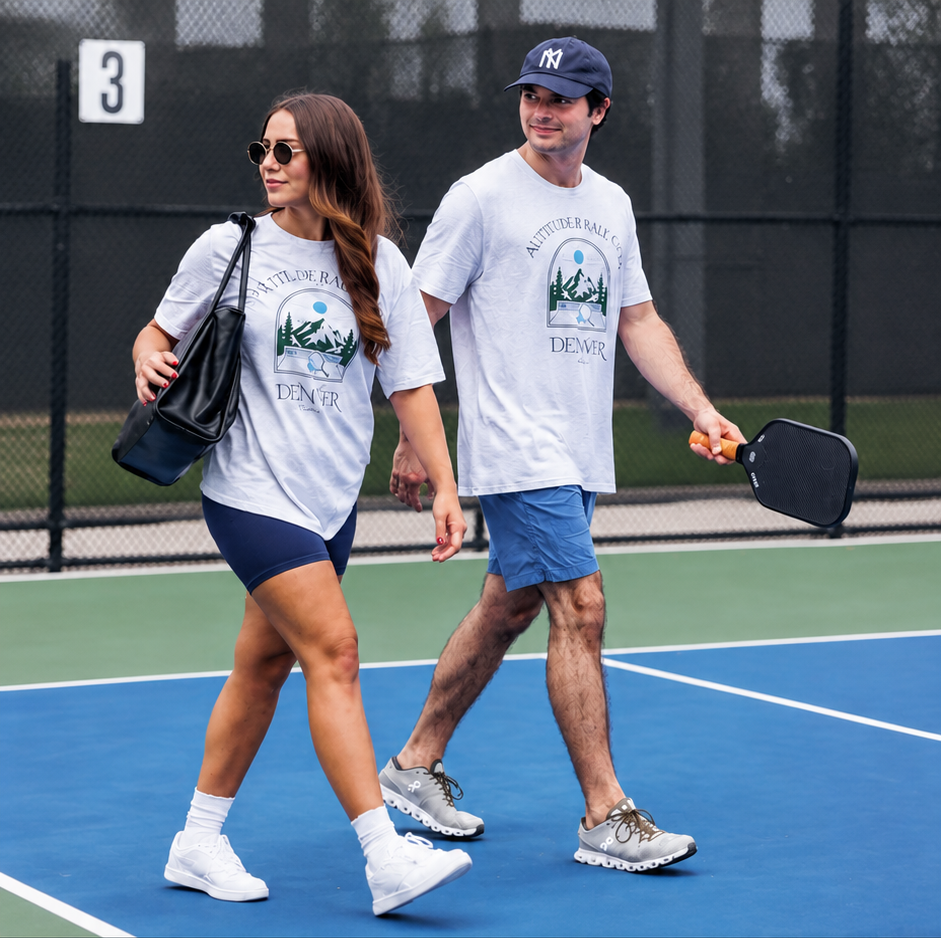 Two pickleball players walking off the court in Courtelane Denver tees