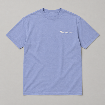 Pressure Looks Good Here pickleball tee by Courtelane in lavender blue, front with small Courtelane logo