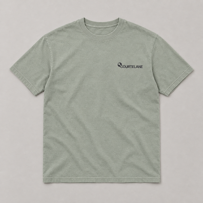 Calm Is a Skill pickleball tee by Courtelane in sage, front with small Courtelane logo