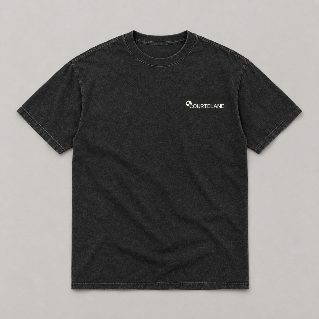 Patience Wins the Kitchen pickleball tee by Courtelane in washed black, front with small Courtelane logo